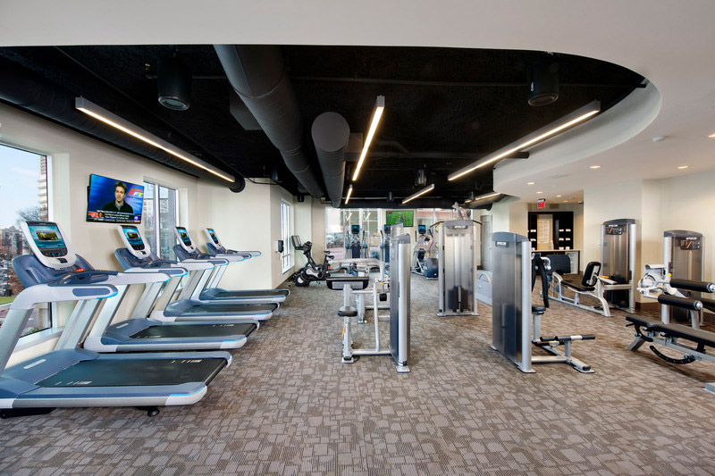 Fitness center with treadmills and strength equipment